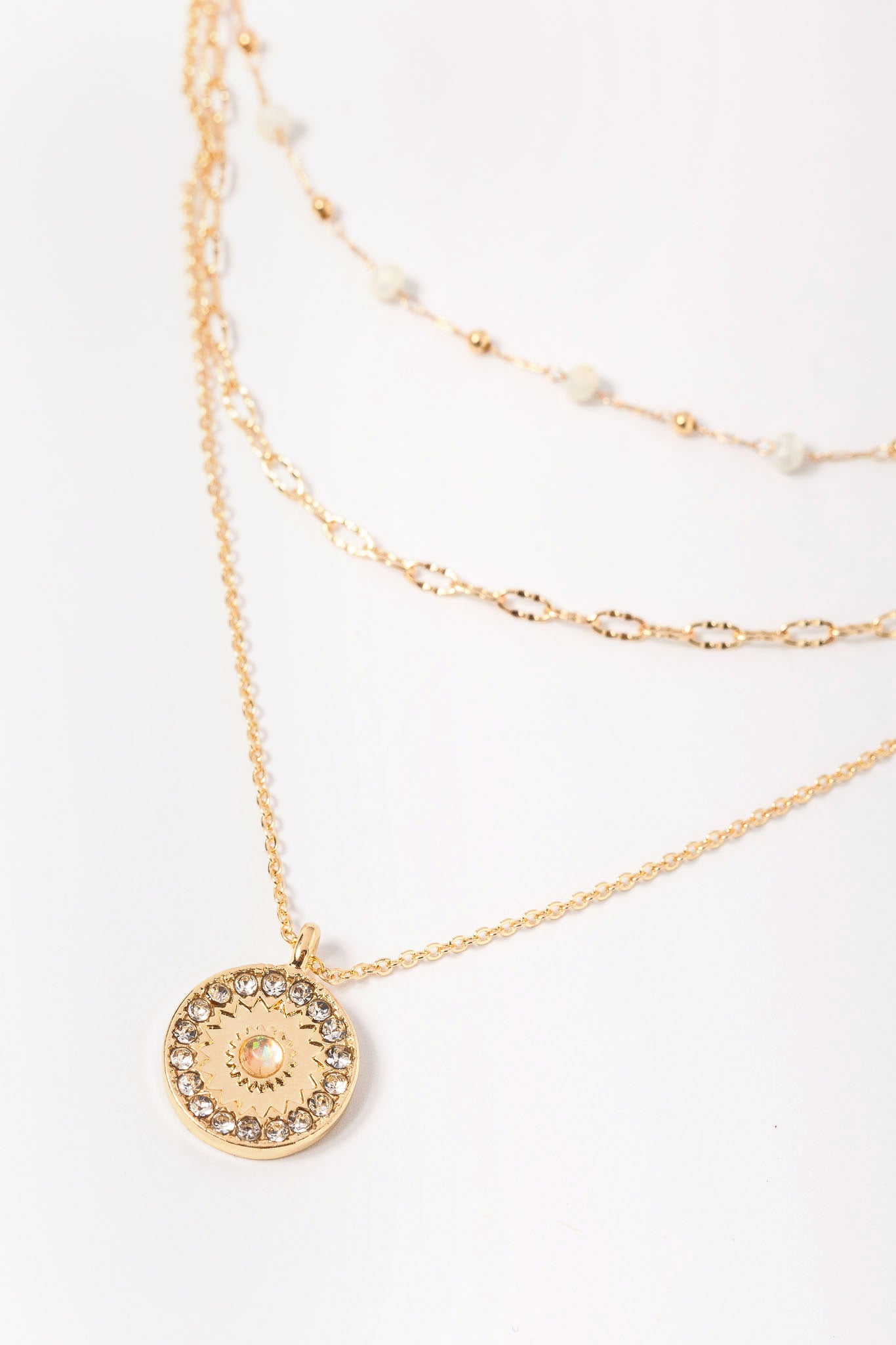 Triple Strand Necklace with Beads and Rhinestone Pendant