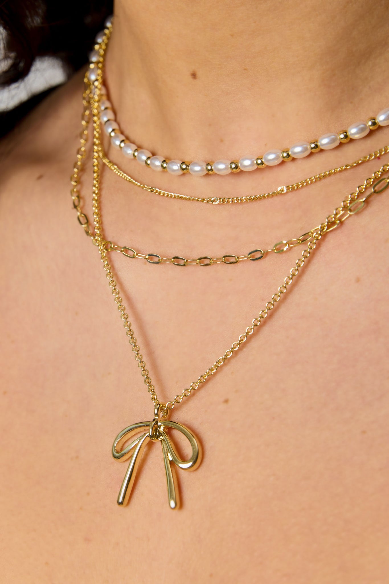 Four-Strand Bow and Pearl Necklace